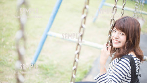 【伊計島】ブランコに乗る美少女 写真素材